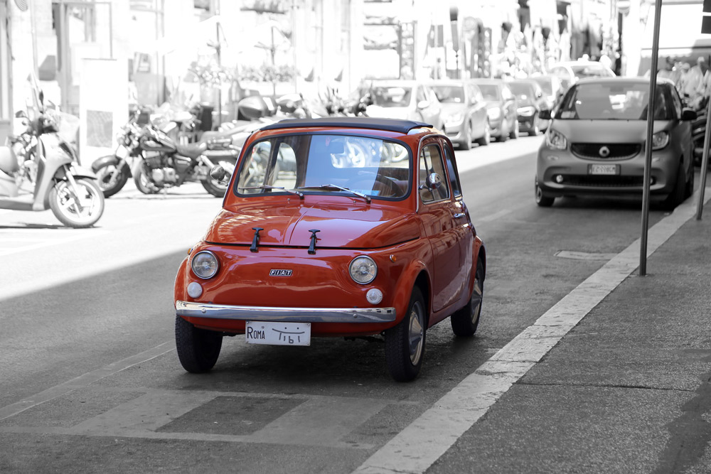 red Fiat on black and white in Rome.